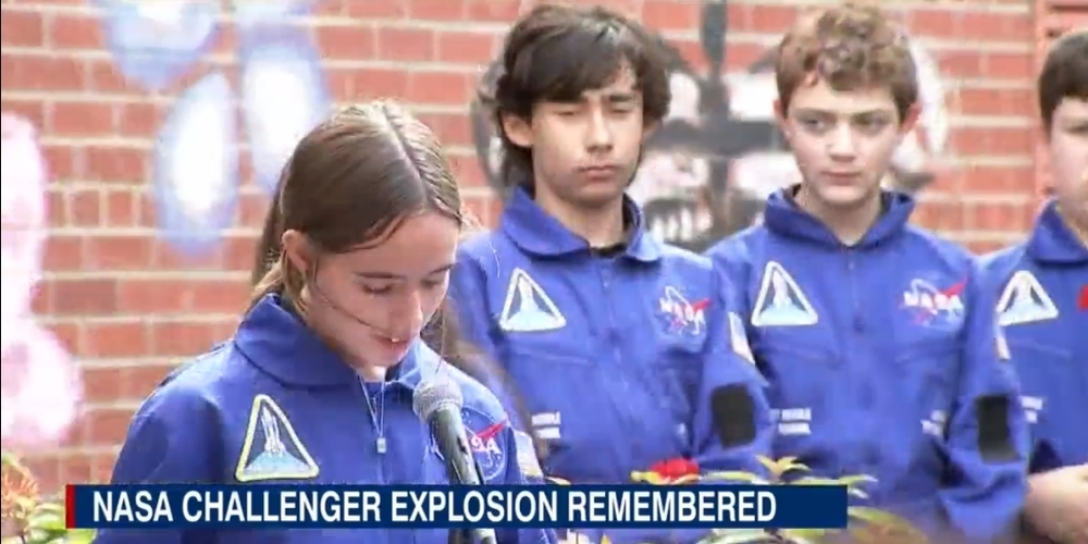 NASA Challenger Explosion remembered - Students in NASA jump suit reading speaches