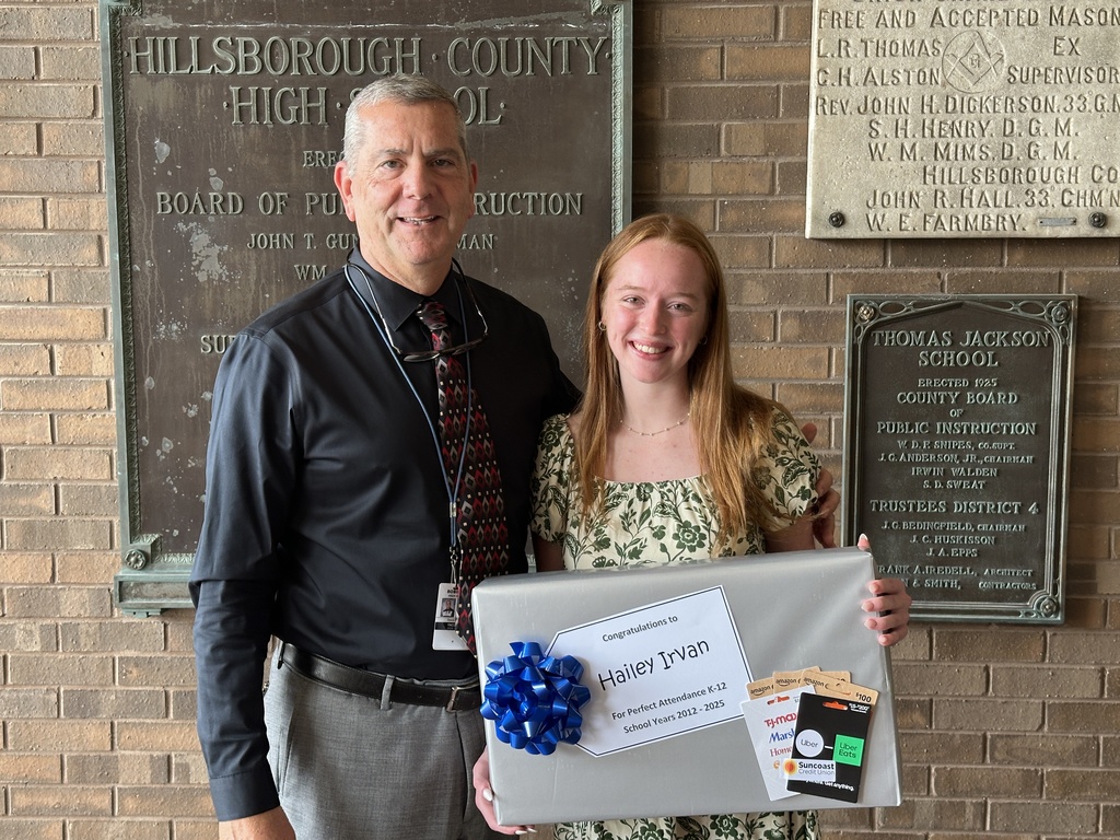 Shown is senior Hailey Irvan from Robinson High School, who received perfect attendance, with her principal, Dave Brown