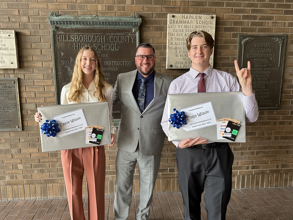 Shown is senior Chloe and Colby Wilson from Bloomingdale High School, who received perfect attendance, with their principal, Marcos Rodriguez