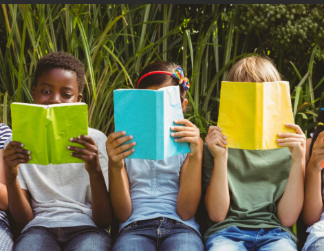 3 kids reading colorful books