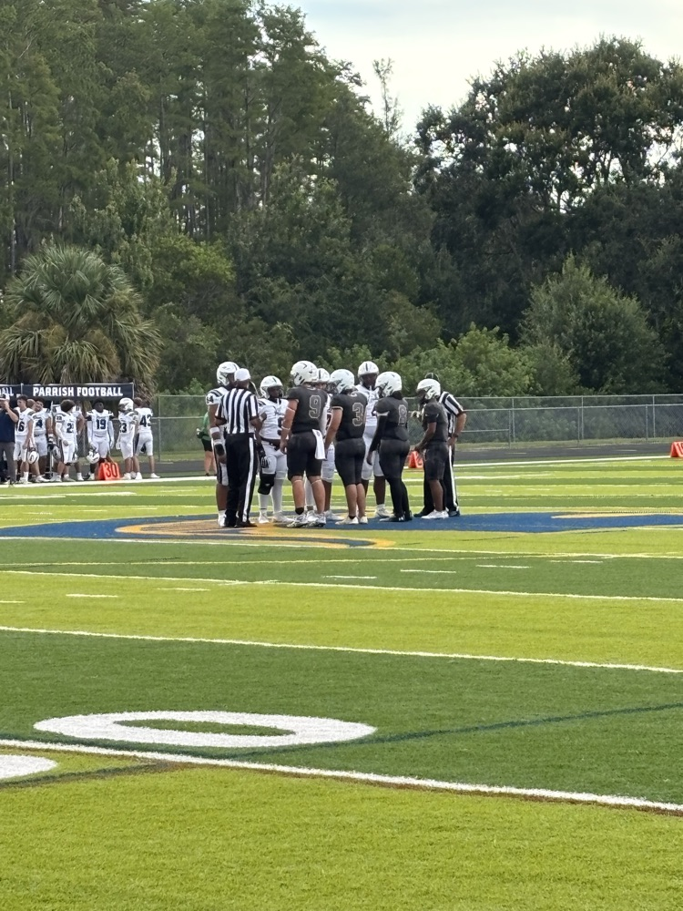 Football team captains ready for the coin flip.
