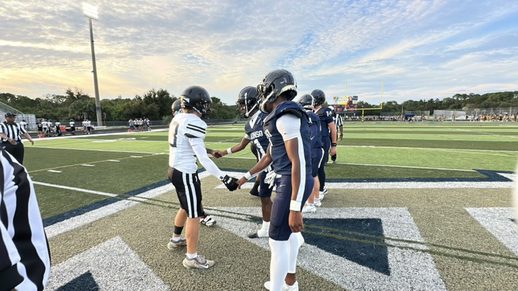 Robinson and Alonso football players 
