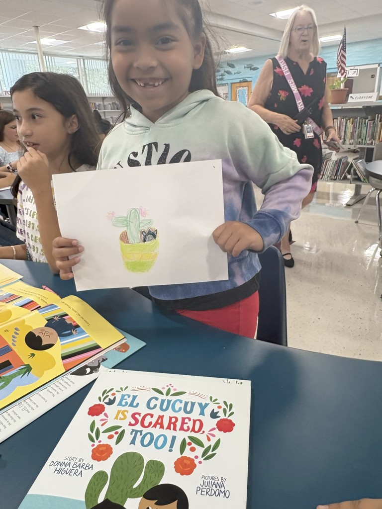 Student sharing their drawing