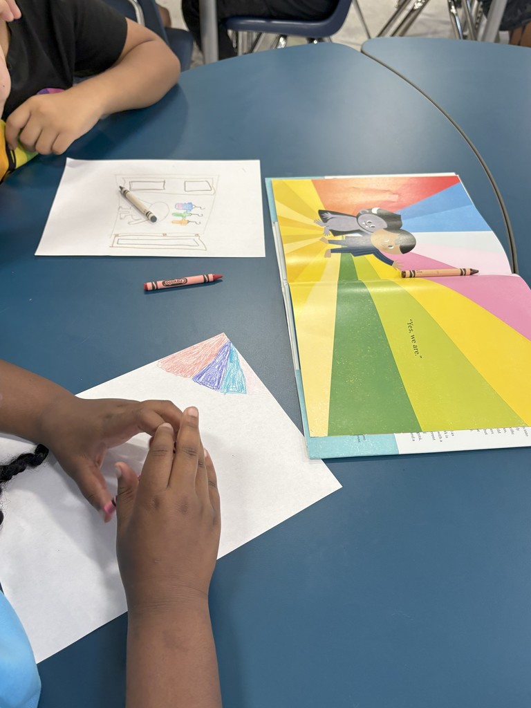 Student drawing their favorite part of a book