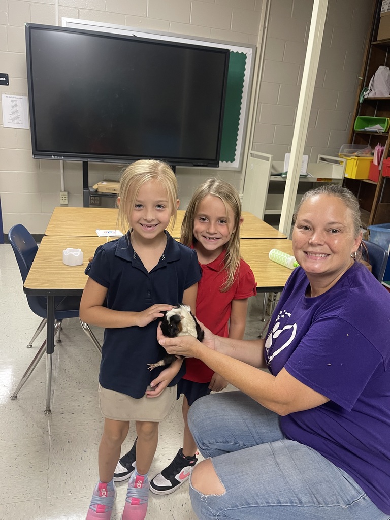 Students with animal from Little Paws Animal Rescue