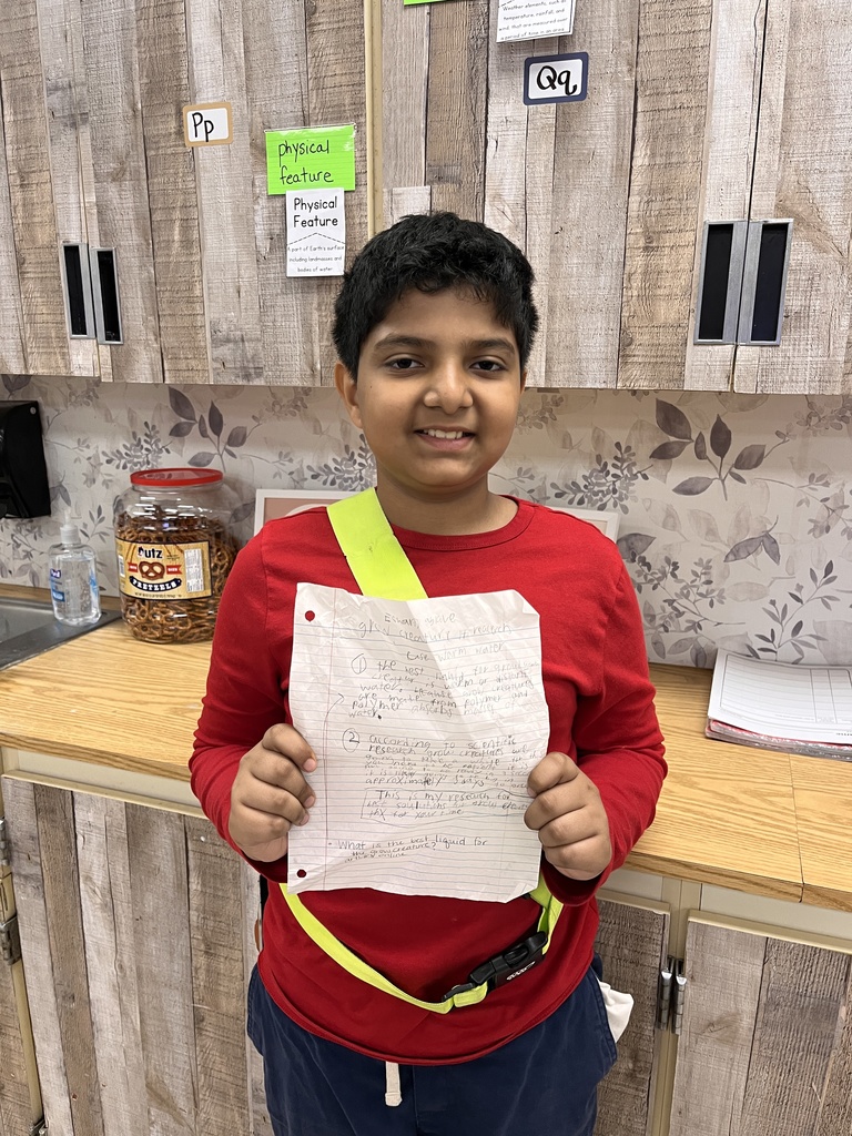 Student holding a paper