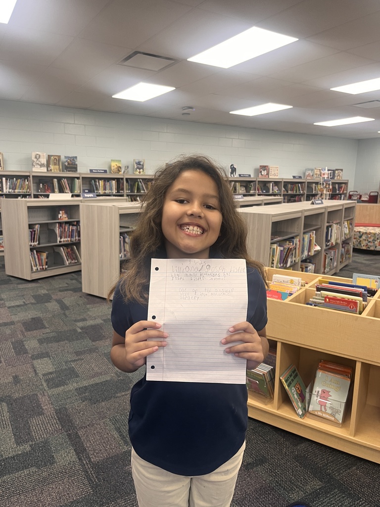 Student holding a paper
