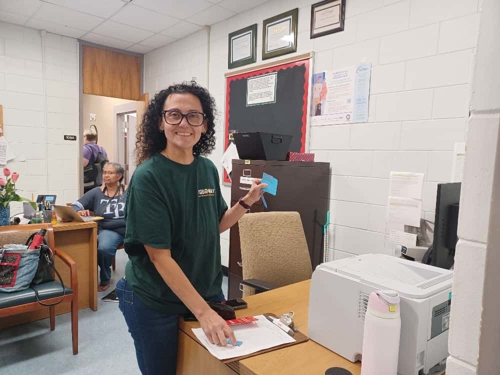 Ms. Parrado keeping records of the winners