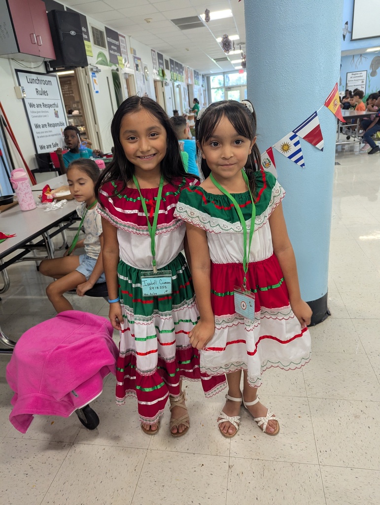 Teachers and students dressed in traditional Hispanic garments
