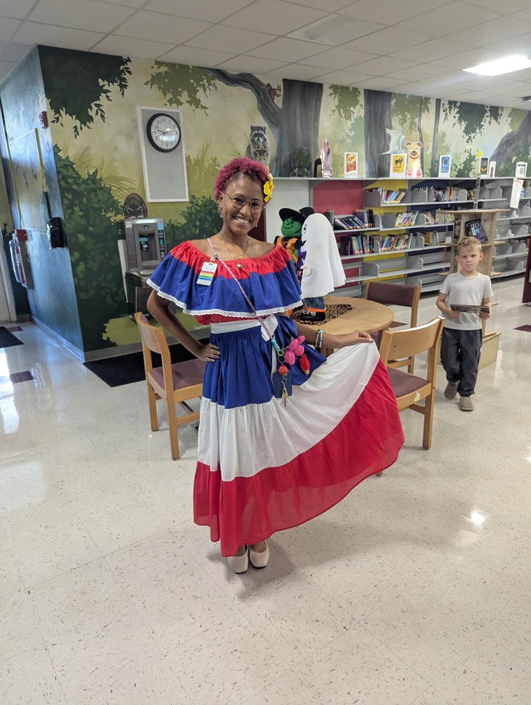 Teachers and students dressed in traditional Hispanic garments