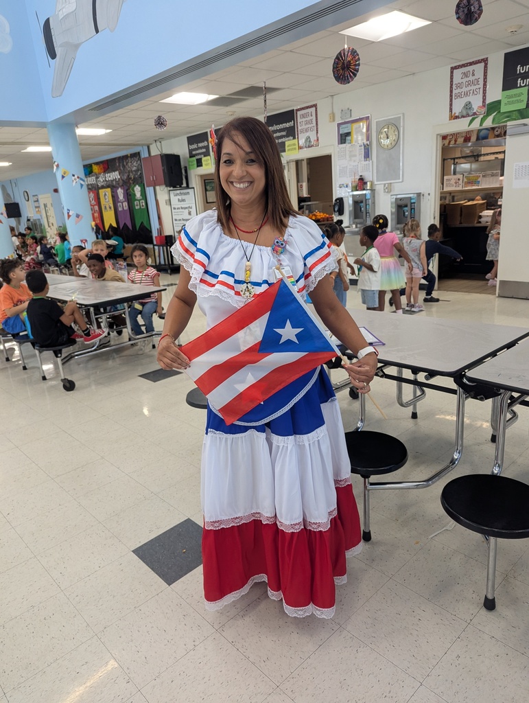 Teachers and students dressed in traditional Hispanic garments