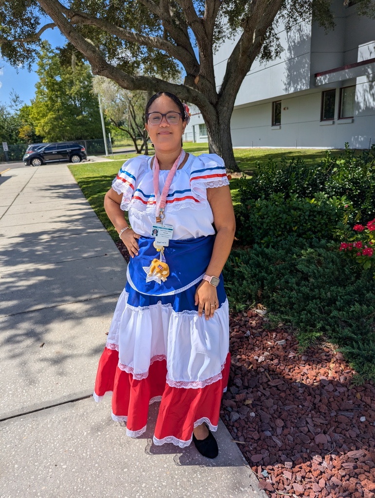 Teachers and students dressed in traditional Hispanic garments