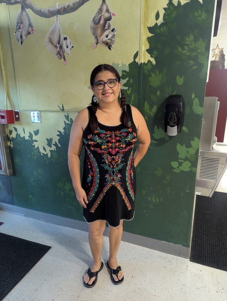 Teachers and students dressed in traditional Hispanic garments