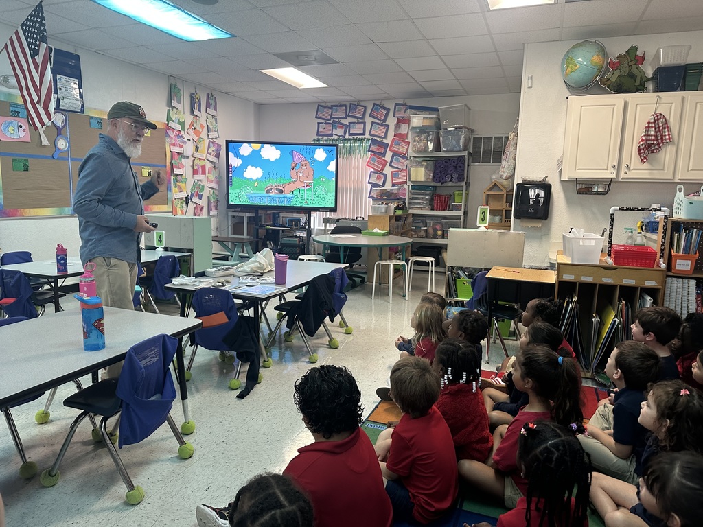 Artist talking to Kindergarten students