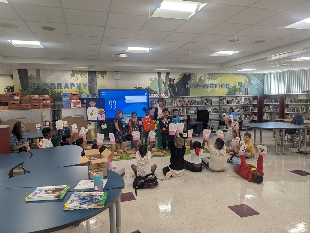 students learning in media center