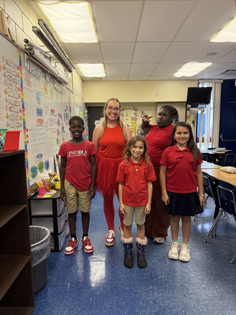Teacher and students dressed in red