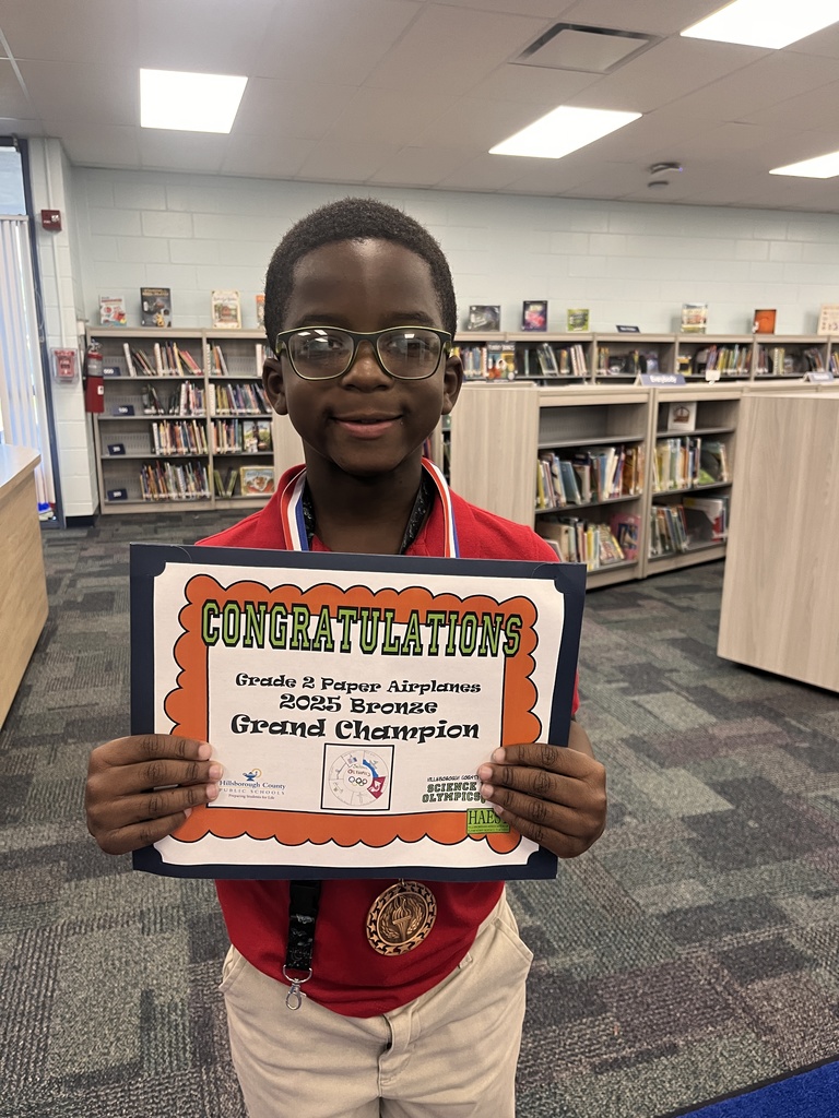 Student with Science Olympics award