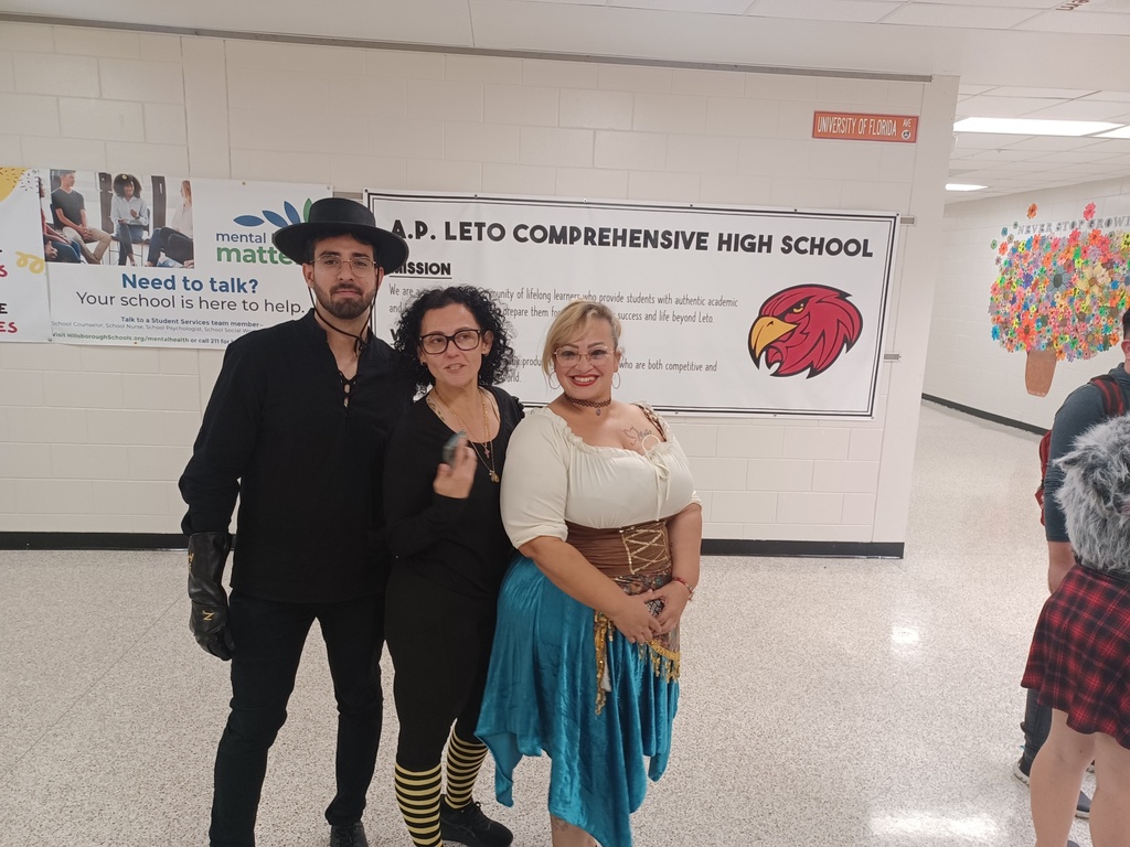 3 students in costumes