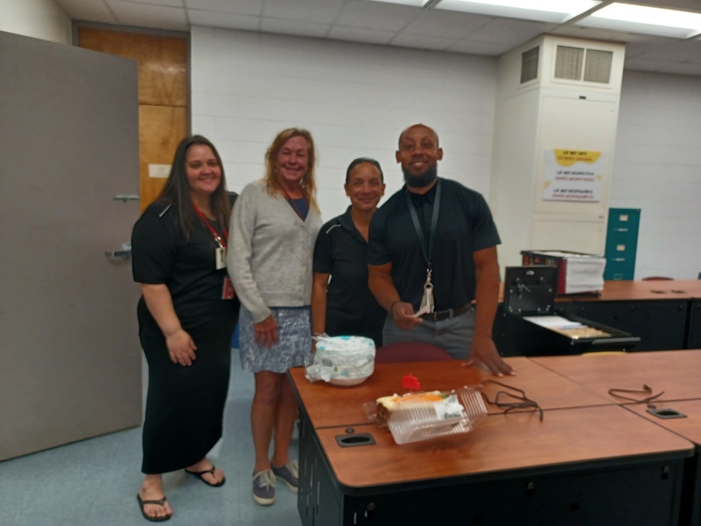 Office staff and birthday cake