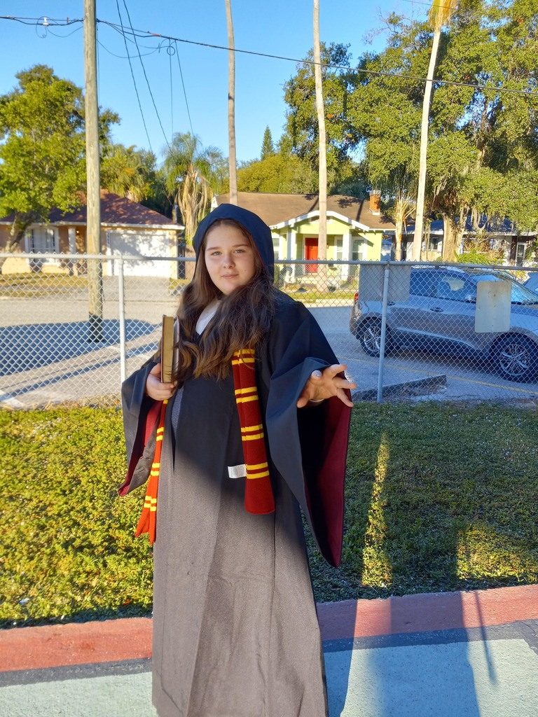 Student dressed to represent Harry Potter book.