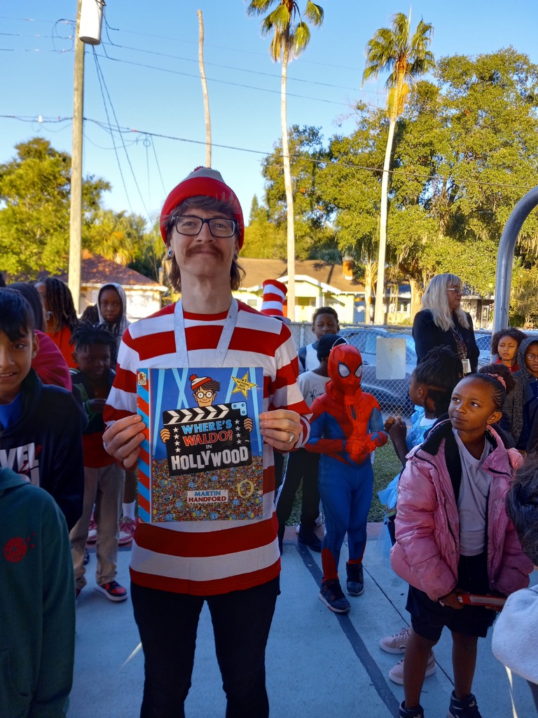 Teacher dressed to represent book.