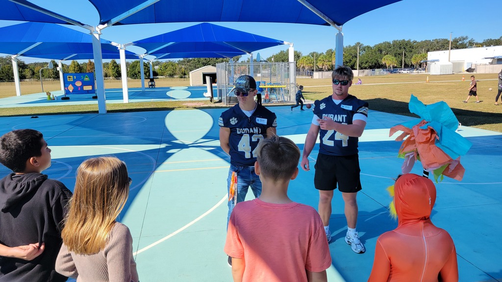 Durant Football Team visits Nelson Elementary students.
