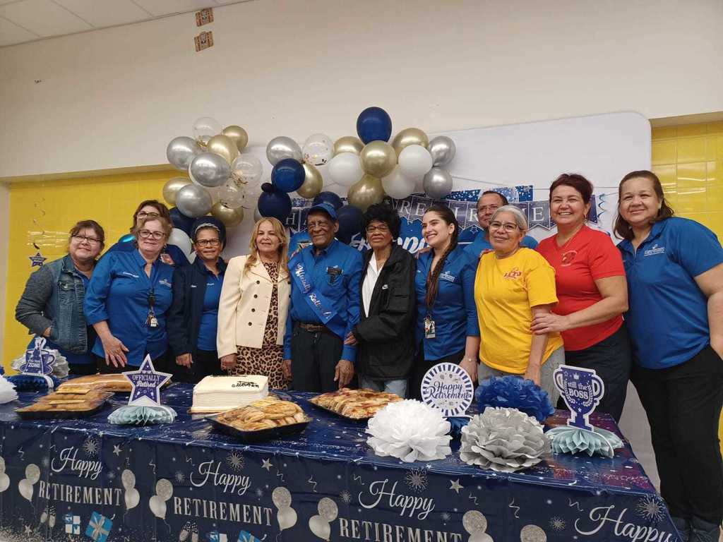 Mr. Pipo with family and staff