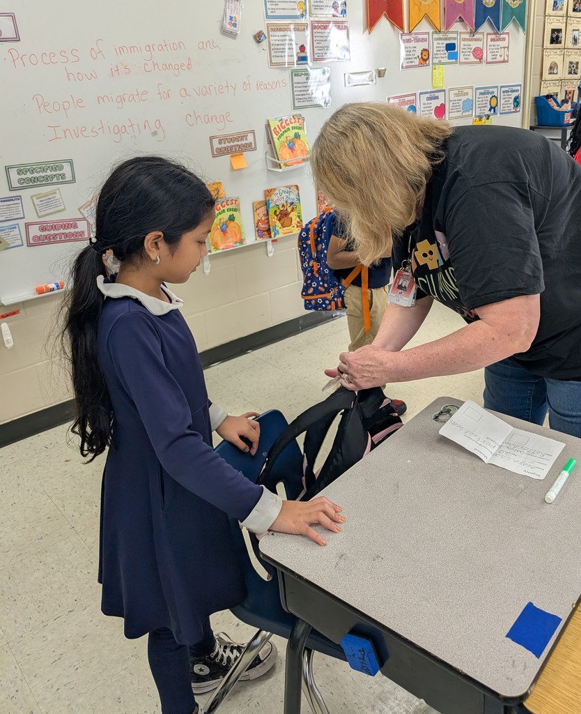 Student with teacher and backpack