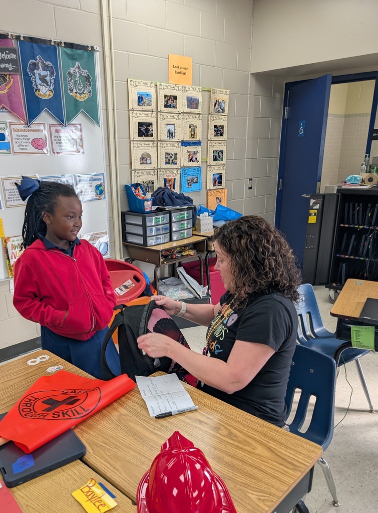 Student with teacher and backpack