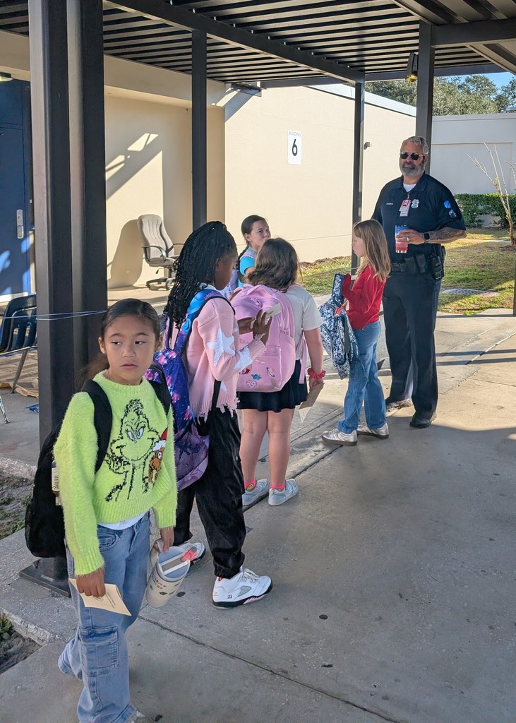 Students lined up with backpacks