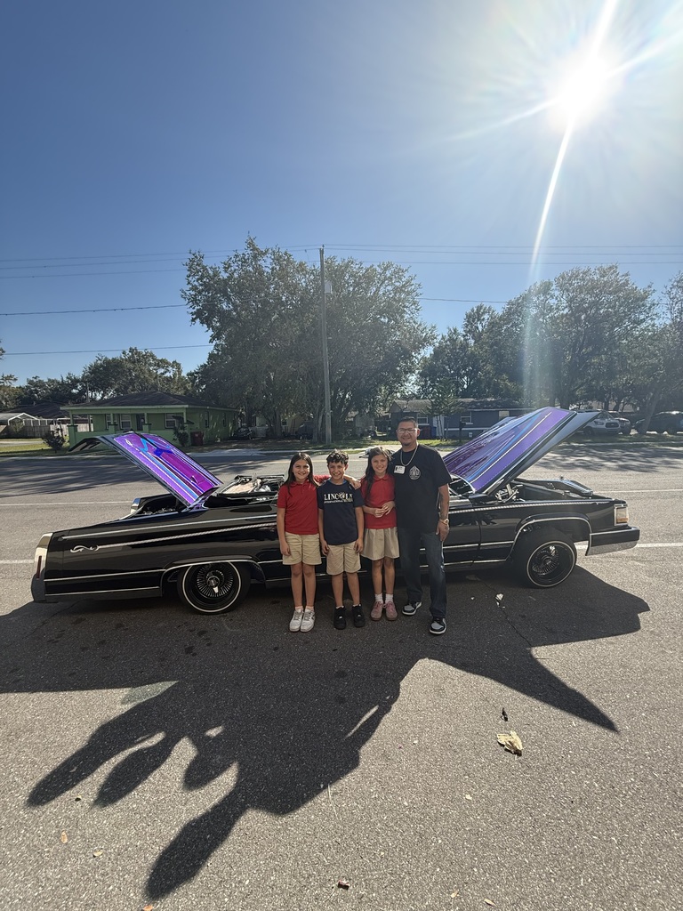 Students with a cool car