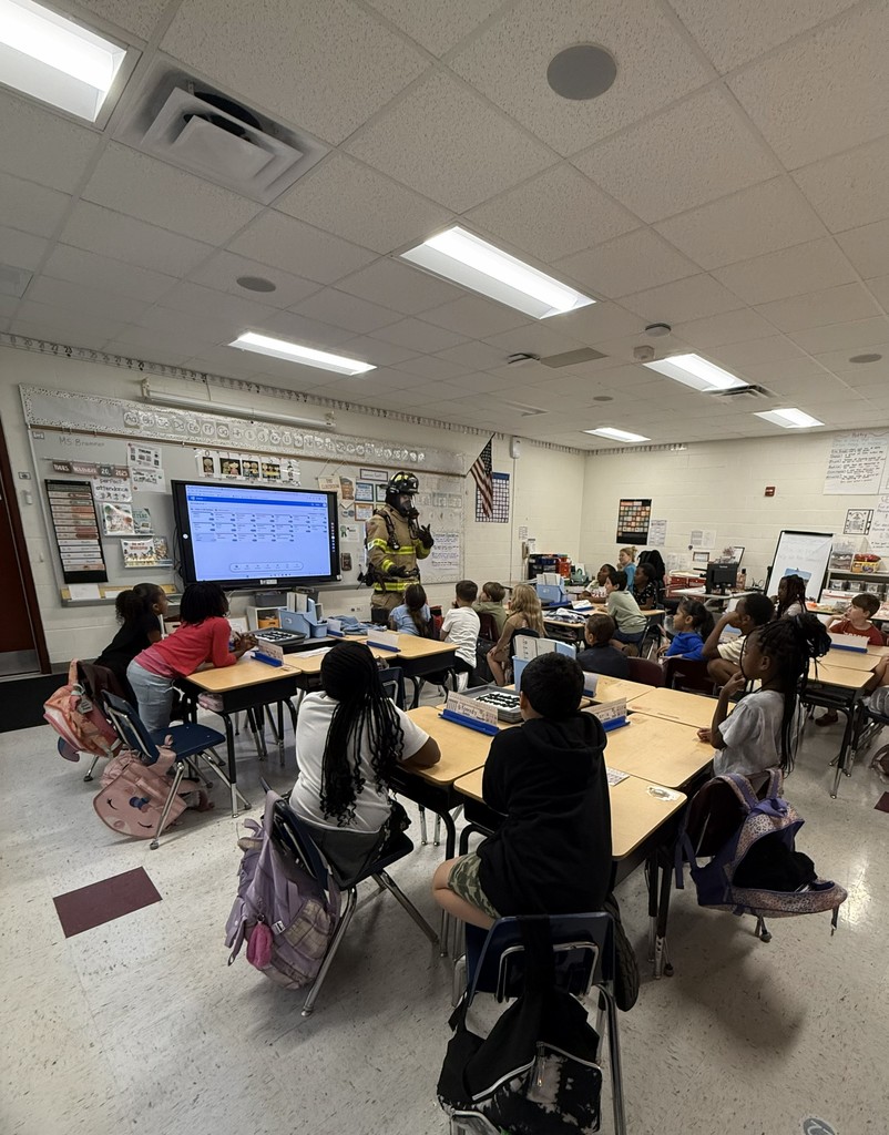 Students with a fireman