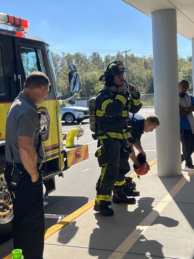 Students with a fireman