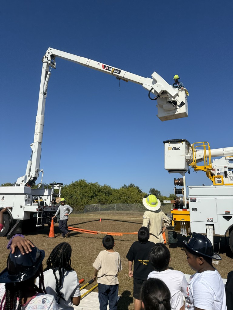 Students and a bucket truck