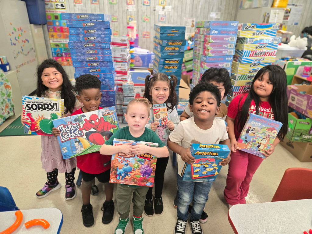 Pre-K Kids with Board Games from Schwarzkopf Elementary PTA