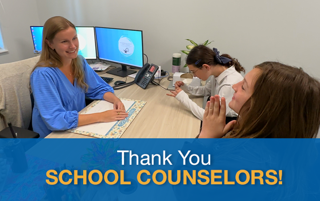an HCPS counselor sitting with two HCPS high school students