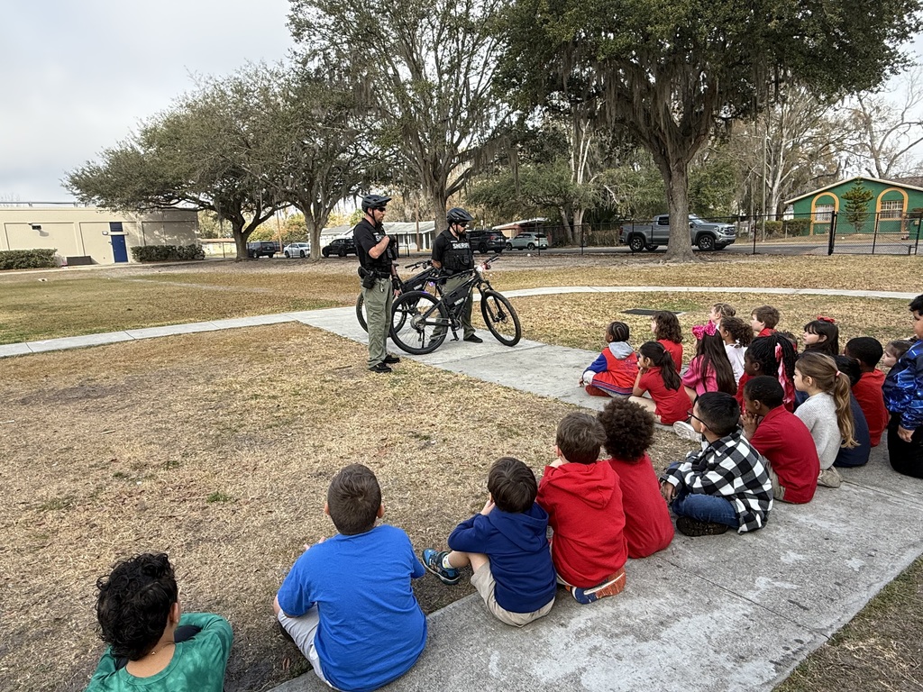 Kindergarten students learning about Hillsborough County Sheriff bike officers