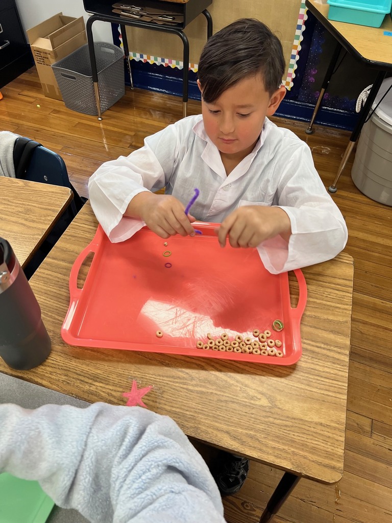 Students in 3rd grade building modeles of vertebrate and invertebrate animals