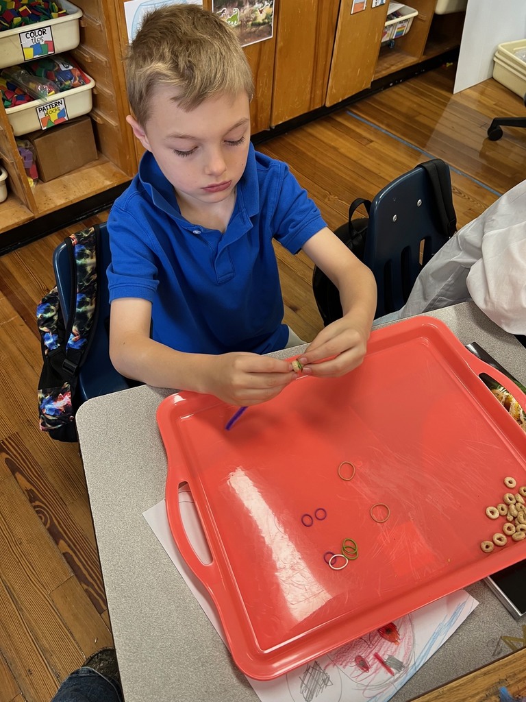 Students in 3rd grade building modeles of vertebrate and invertebrate animals