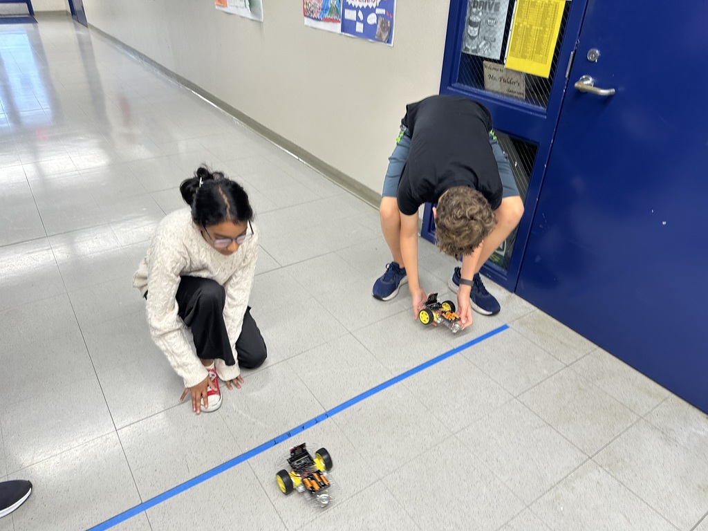 Students participating with Robots