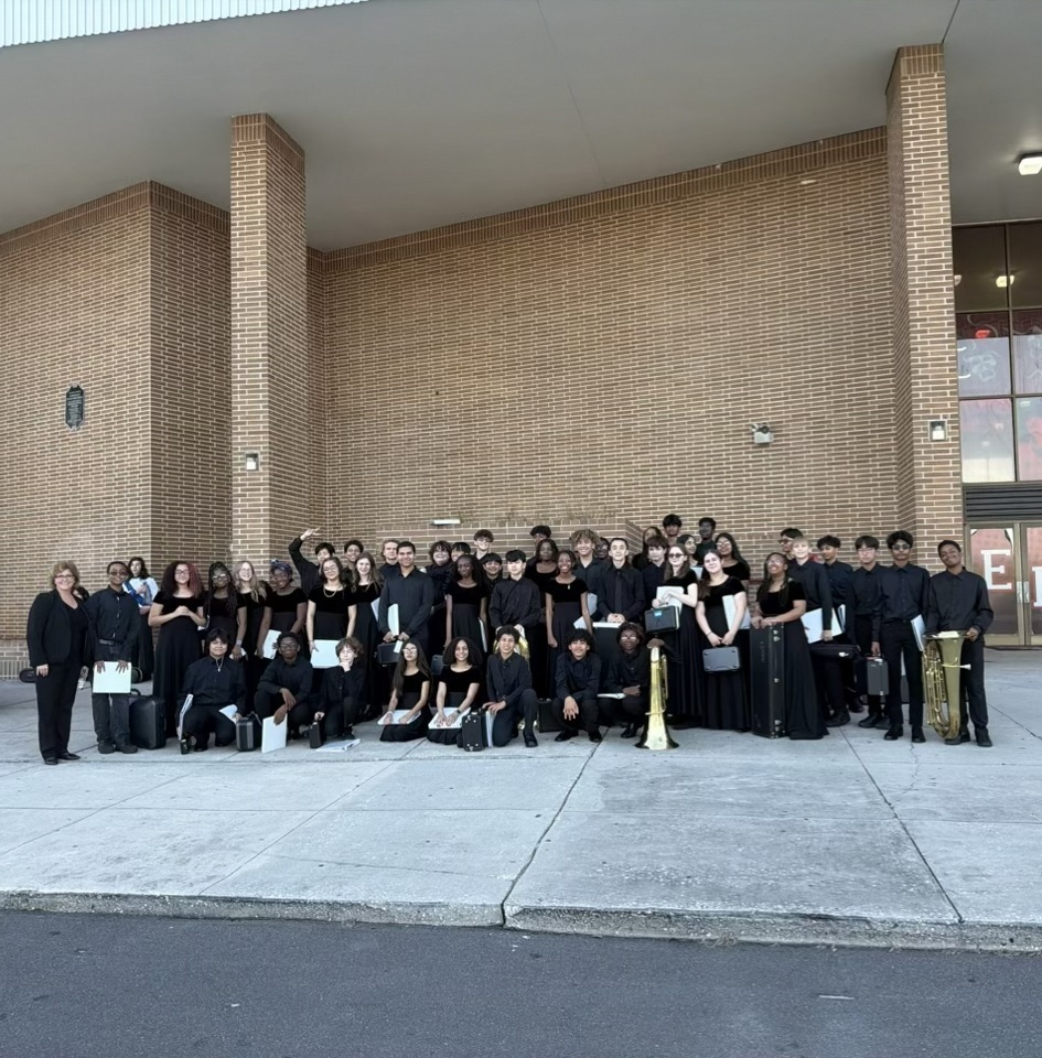 Students standing in front of building