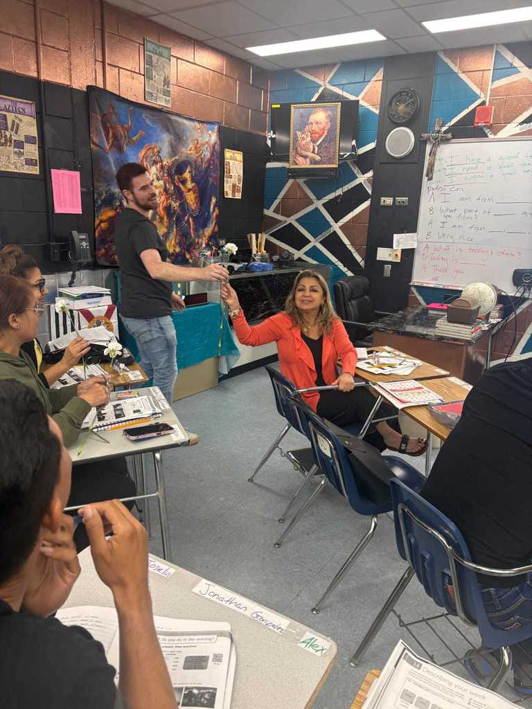 man giving woman a flower