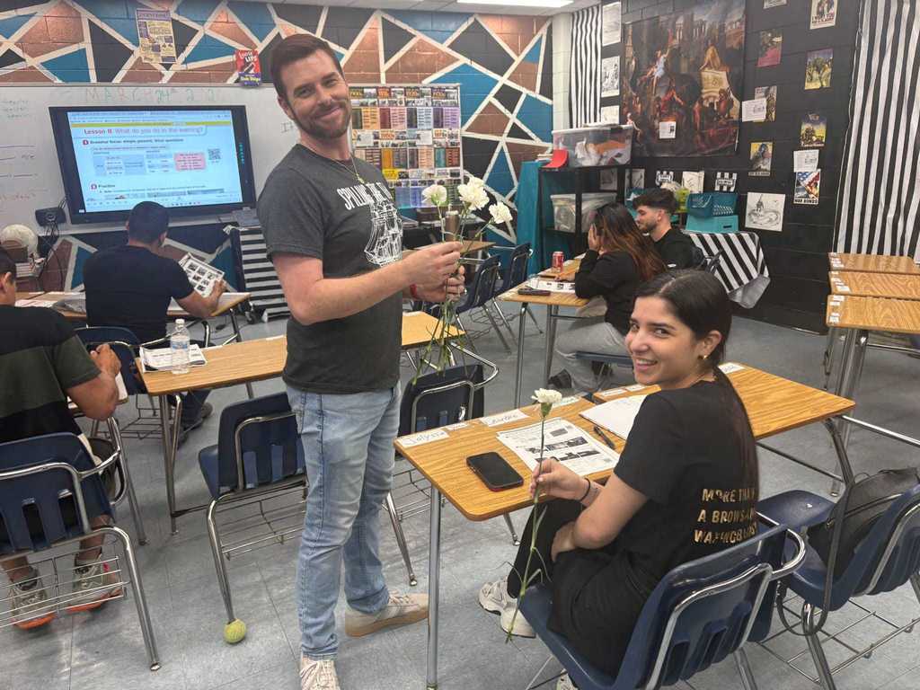 man giving women flowers