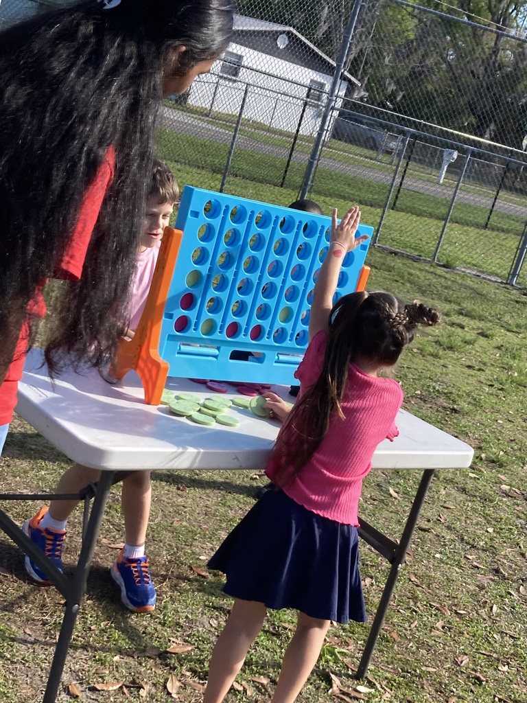 Students playing connect four
