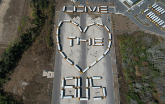 School buses spelling out "Love the Bus"
