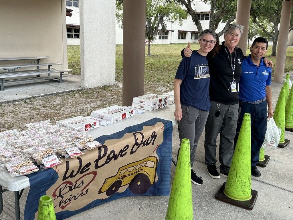 Picture of the Steinbrenner PTSA, Administration, and Custodial staff representatives set up to welcome bus drivers on Bus Driver Appreciation Day.