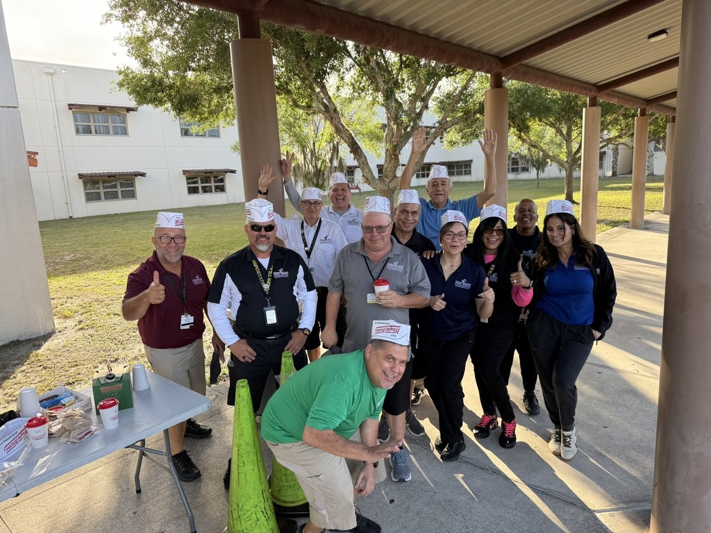 Bus drivers having a party on the Steinbrenner bus ramp in the AM on Bus Driver Appreciation Dayl.