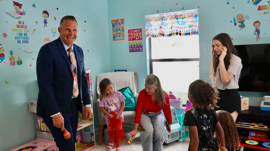Superintendent with students at 1Voice ceremony