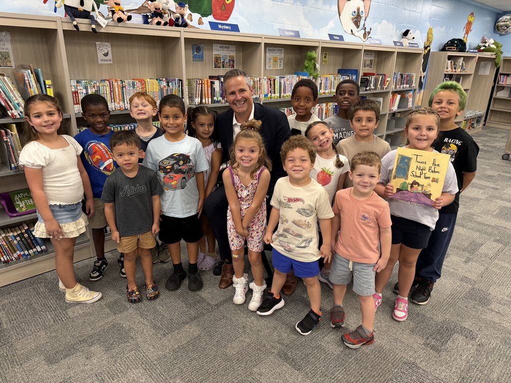 Superintendent Ayres with a group of students