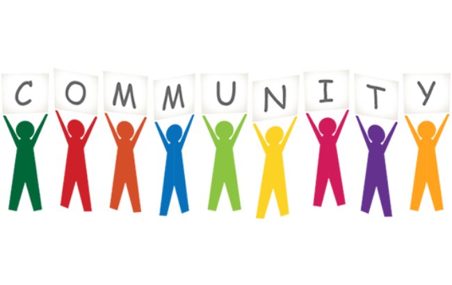 People standing together with the word community spelled out.